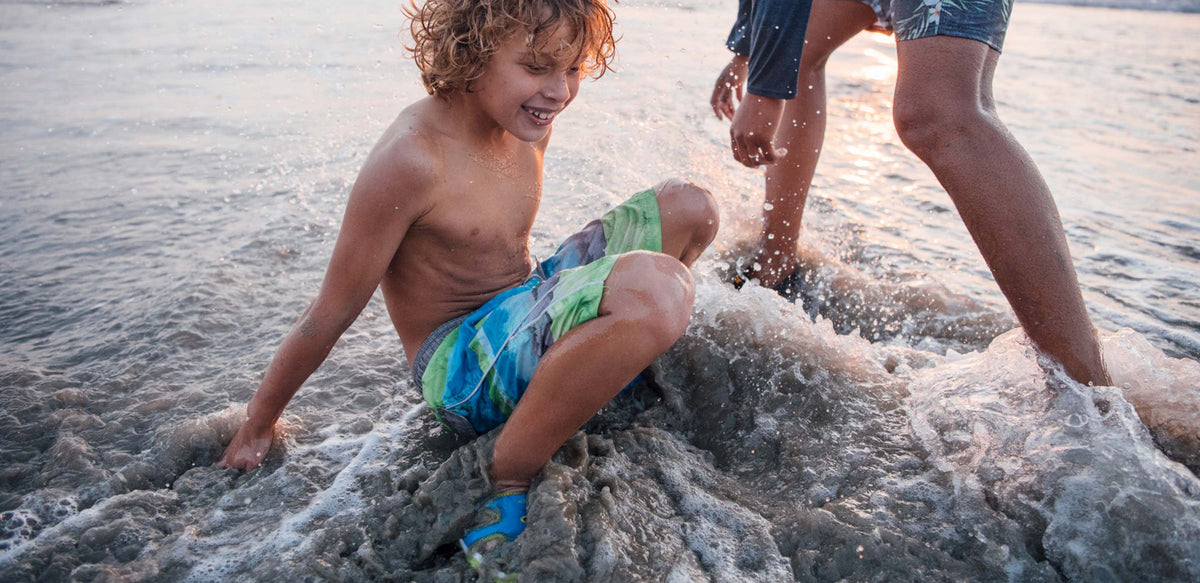 Kids playing at the beach in KEEN sandals