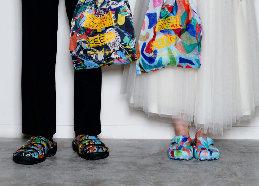 Kneed down shot of man in black pants and woman in white dress wearing KEEN and Artpara Fukagawa collaboration Yoguis
