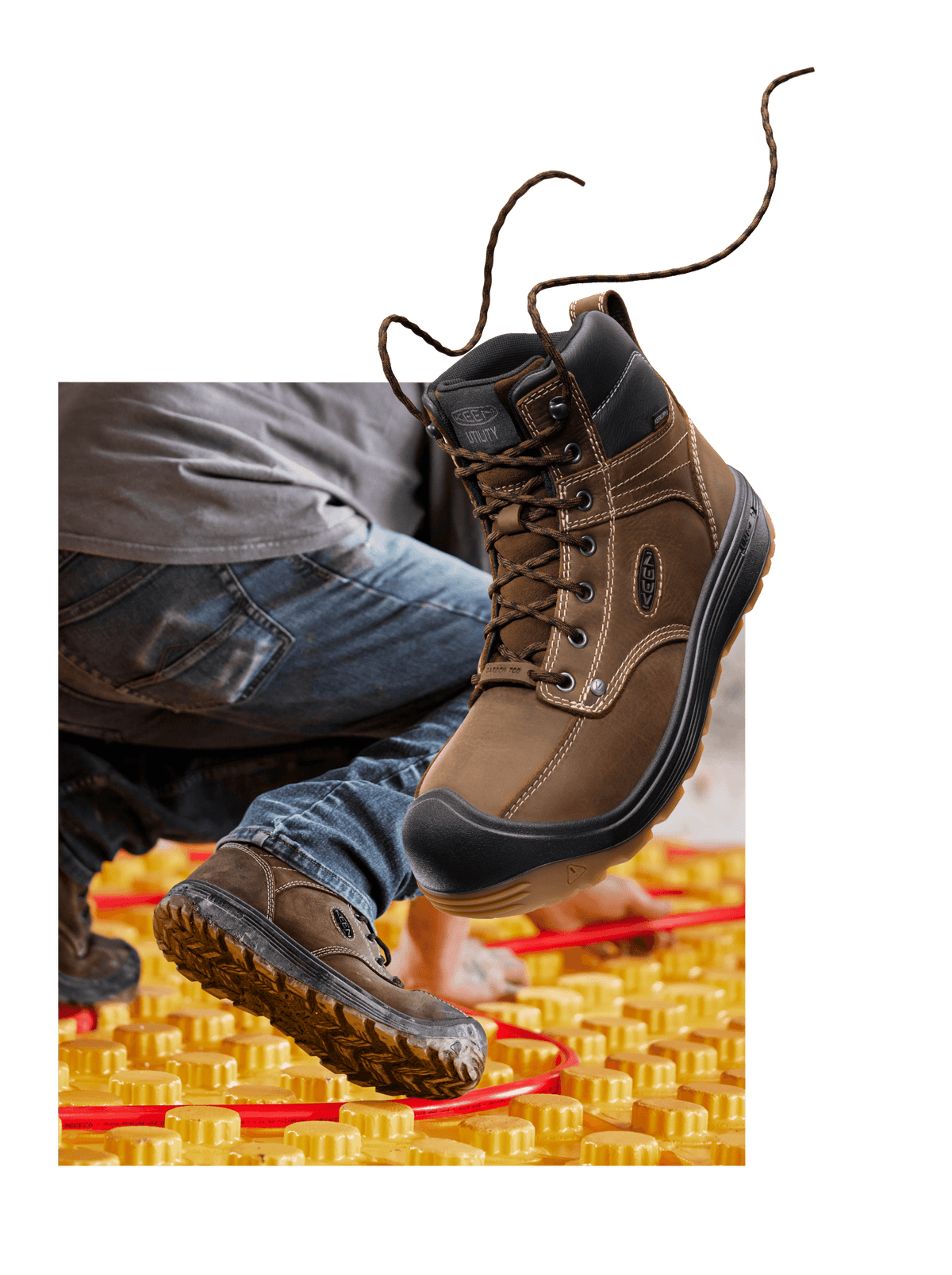 Fort Wayne work boot against yellow, textured background