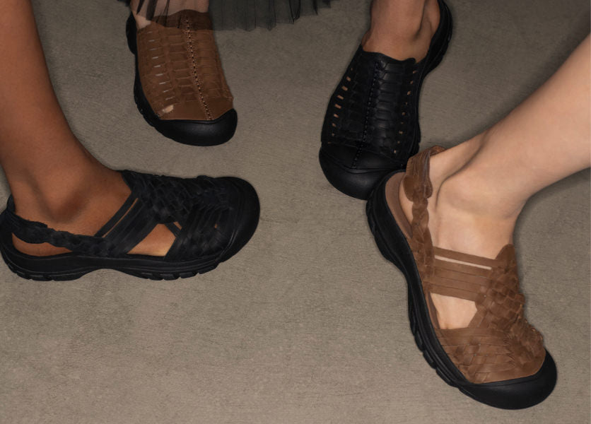 Knee-down shot of four people wearing various KEEN and Hyke collaboration shoes