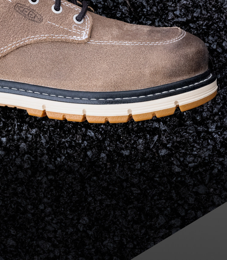 A close-up of the sole/front of a brown KEEN work boot.