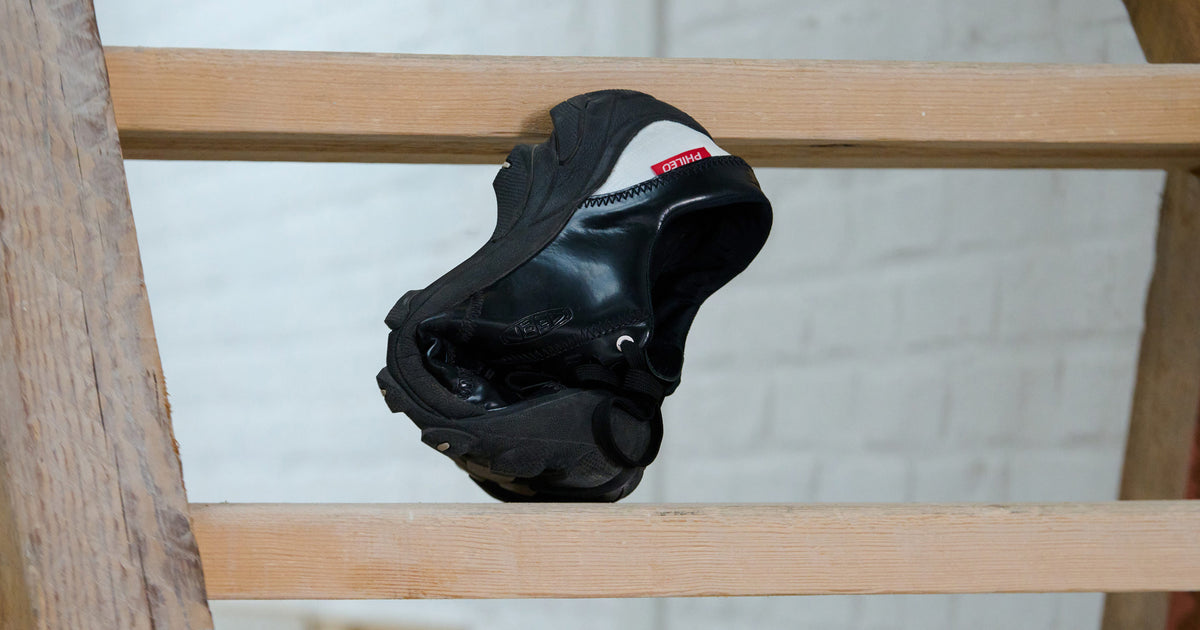 Targher shoe displaying it's flexibility with toe bent to touch tongue of shoe