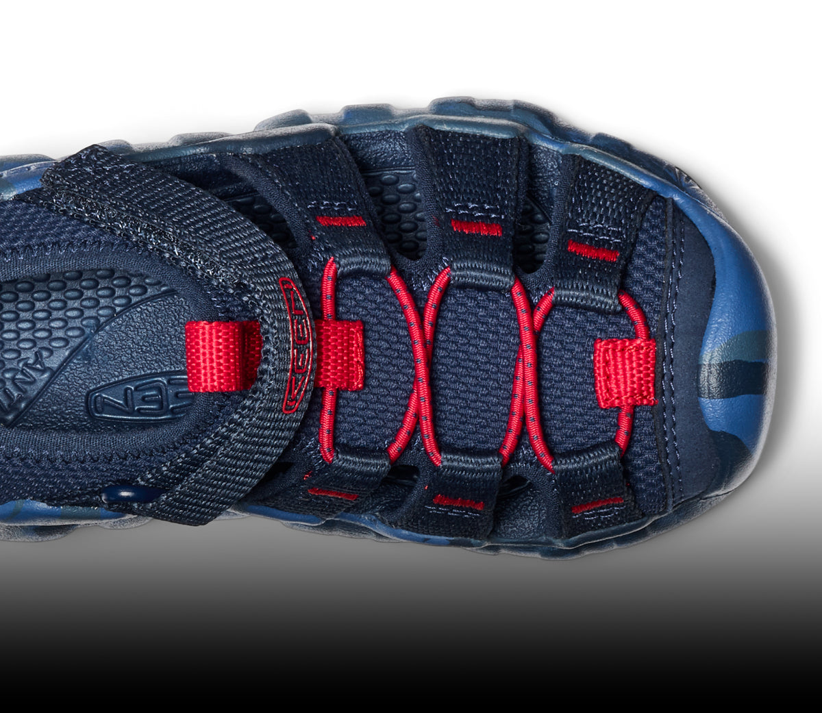A blue and red KEEN kids' sandal shown from above.