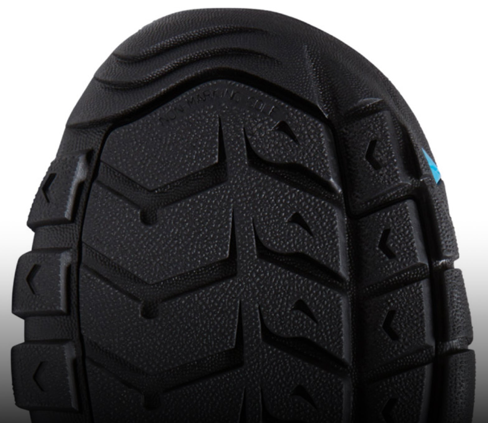 A close-up of the black undersole of a Newport sandal.