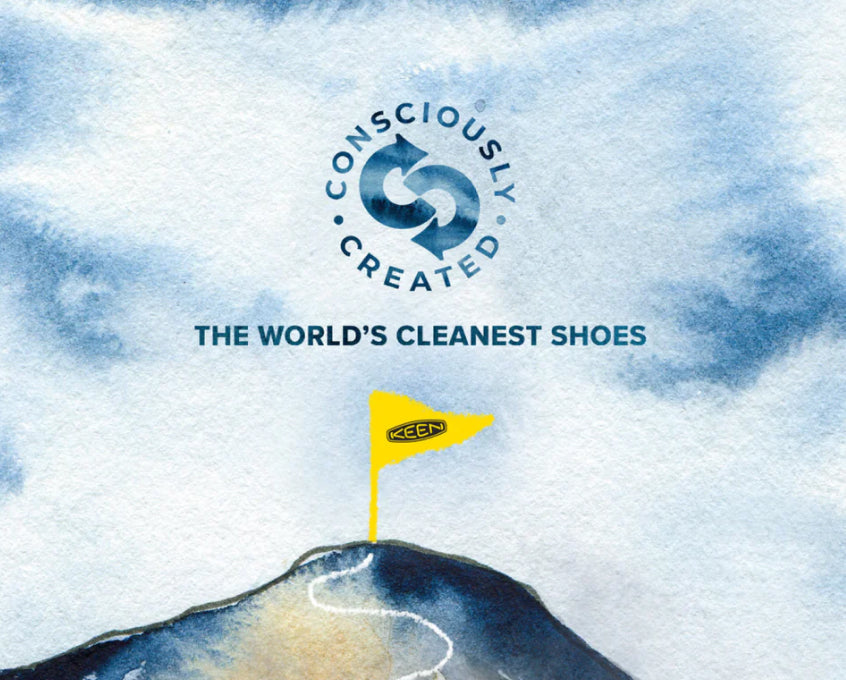 Watercolor illustration of a mountain peak with a yellow KEEN flag, featuring the text "CONSCIOUSLY CREATED THE WORLD’S CLEANEST SHOES."